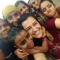 Volunteer from Italy posing with children in Jaipur, India with The Tarzan Way