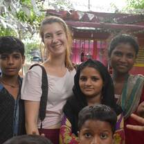 Volunteer from Italy posing with children in Jaipur, India with The Tarzan Way