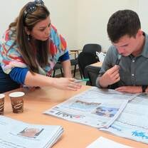 A teacher helping a student with classwork