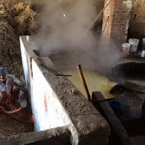 The program took us on a trip to Mysore, India. We happened to stop at this sugar cane farm where two men were grinding and boiling sugar cane.