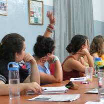 Students listening and engaging to a lecture in a classroom. 