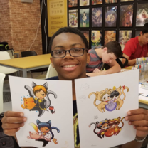 Student showing anime drawings