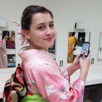 A student poses in a kimono 