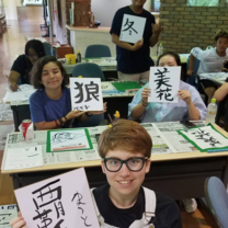 Students practicing writing in Japanese