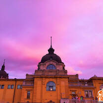 old building with dome and purple skies