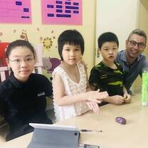 Italian volunteer teaching children English at Baby's Home in Shanghai
