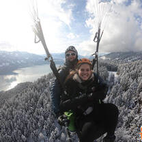 flying with a parachute above mountains