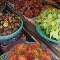Different fruits and vegetables in bowls. 