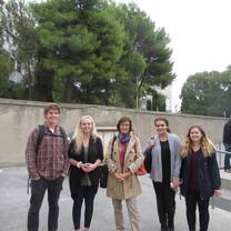 Students posing for a photo outside. 