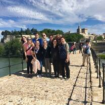 Group of students together on a beautiful day on a food bridge. 