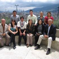 Faculty sitting together outside. 