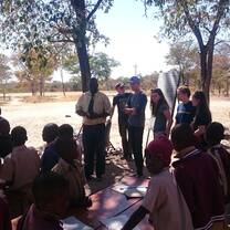 interns with school children