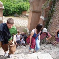 Study & Intern in Florence Students walking up stone stairs outside.