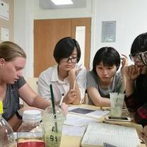 students around a table learning