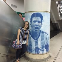 Image description: I am standing in a subway station with a massive image of Messi, the famous Argentina soccer player. 