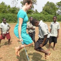 Volunteers in Uganda playing with the children on their gap year