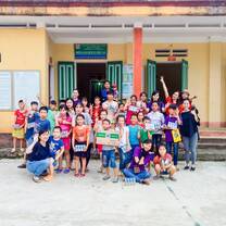 group in front of a house