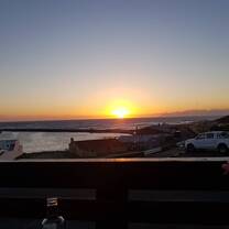 Sunset during which whales could be seen breaching in the distance.