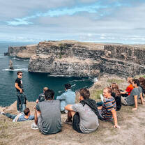Sage Corps Dublin cohort sitting at the cliffs