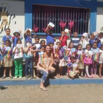 Here's a photo of some of our younger kids with a volunteer.