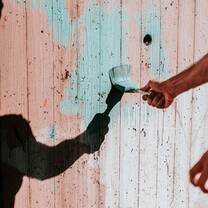 Man throwing dirt off of his hands