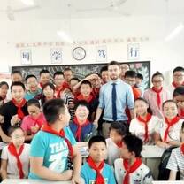 Tom with students