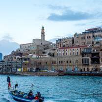 Tel Aviv Old Cityscape  in front of bright blue water