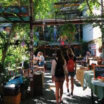 This is the Szimpla Kert ruin bar, which becomes a market on Sundays. It was the first "ruin bar" which is a building that was damaged in WWII and has been turned into a bar or restaurant.