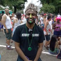 my first ever appearance at a street party (bloquinho) in São Paulo with a cocar (type of hat worn by Native American chiefs) on my head.