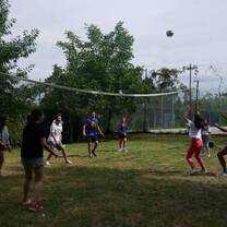 Students playing volleyball outside