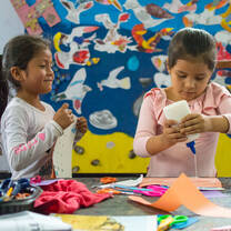 Young girls enjoying art class at SKIP