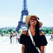 woman outside eiffel tower