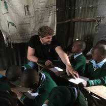 Volunteers teaching pre-school and primary school children.