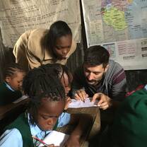 Volunteers teaching pre-school and primary school children.