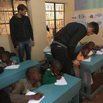 Volunteers teaching pre-school and primary school children.