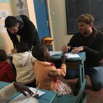 Volunteers teaching pre-school and primary school children.