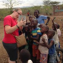 Volunteer having fun with kids.