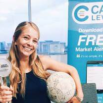 girl with volleyball and trophy