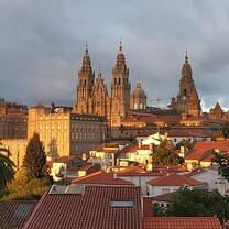 Santiago de Compostela cityscape with dark clouds