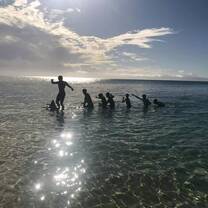 With the help of a local Fijian, we dragged a fallen palm tree out to sea and set sail on our makeshift boat