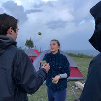 Anya juggling limes on top of Mogote, DR, after a bear crawling 4 1/2 hour hike.