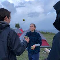 Anya juggling limes on top of Mogote, DR, after a bear crawling 4 1/2 hour hike.