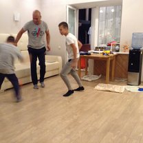 Dad and the boys play front room football