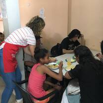 Serving meals to the people in the neighbourhood