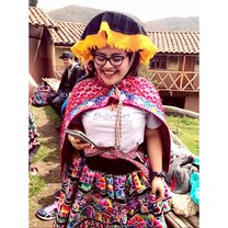 Patty Valencia, EdOdyssey's study abroad coordinator, with students visiting and learning about a local Andean community Excursion to Cusco - Study Abroad EdOdyssey