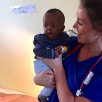 Medical intern holding baby