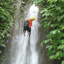 Canyoning down the jungle waterfalls.
