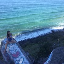 This photo was taken at Cock Rock in Burleigh Heads in Gold Coast Australia. It is a rock formation that juts out of the side of cliff and provides an amazing view of the Gold Coast coastline. 