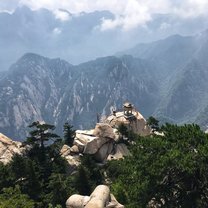 The famed Chess Pavilion on Huashan Mountain in Shaanxi province of central China. One can climb down to the pavilion using a harness system, and view the breathtaking mountain range.