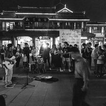 Playing music on the street in Chongqing, China.